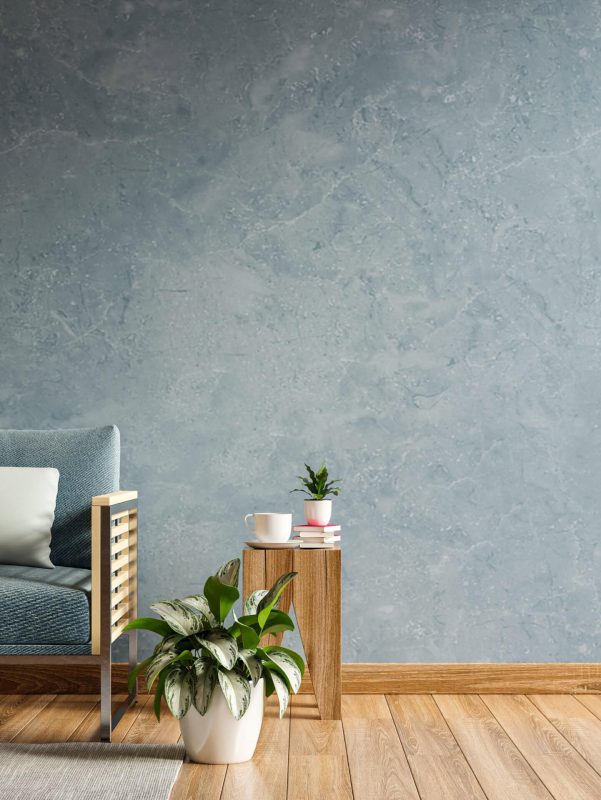 A comfortable living room with a modern gray sofa and wooden side table.