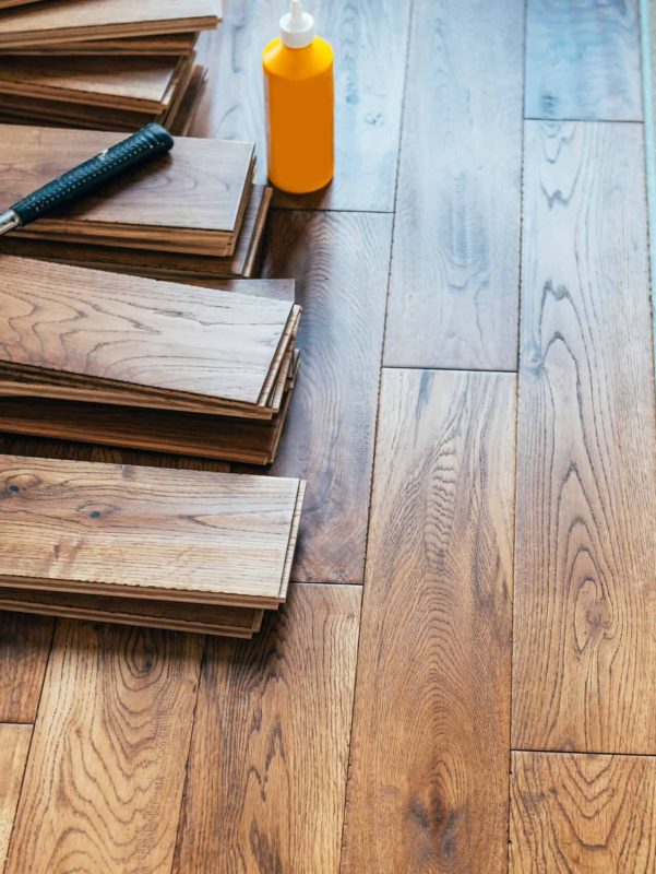 The process of house renovation with changing of the floor from carpets to solid oak wood. Beautiful golden handscraped oiled European oak brushed for added texture and fine definition of wood grain